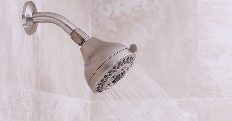 Water Is Dripping From The Shower Head While It Is On