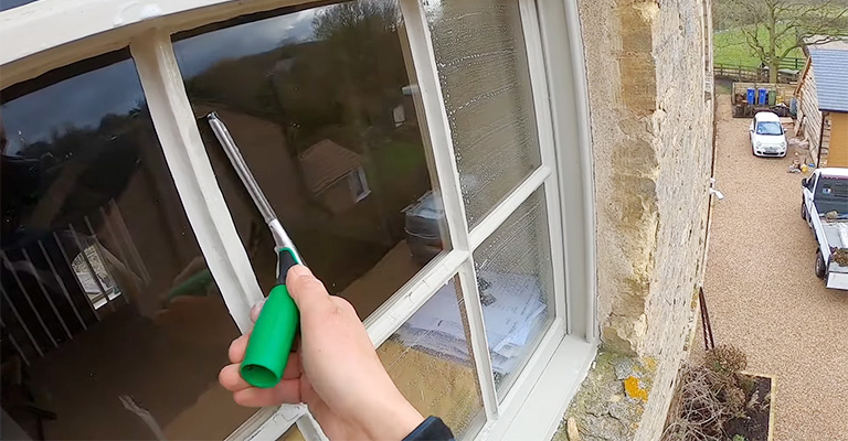 How To Clean High Upstairs Windows With A Ladder