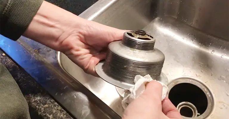 Apply Silicone Caulk On The Sink Drain Flange