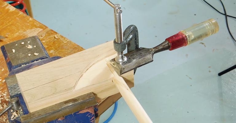 How Do I Use a Sharp Chisel to Cut a Wooden Dowel