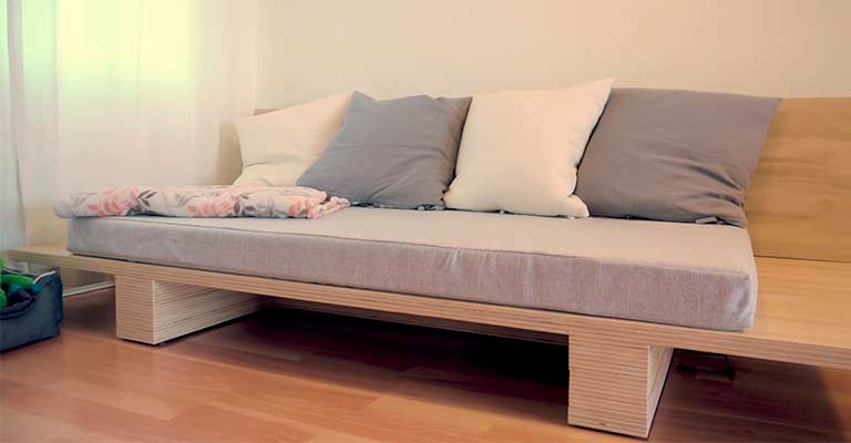Use Two Old Bed Frames to Create an L-Shaped Sofa